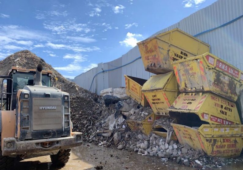 * waste-stockpiled-skips.jpeg